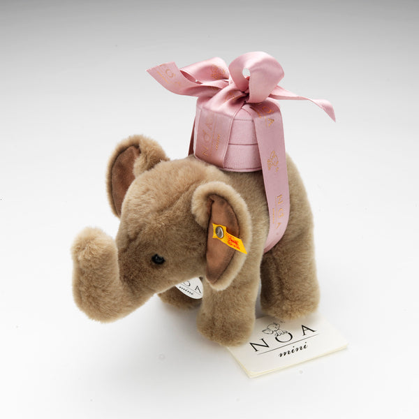 A plush Steiff elephant toy is gifted with each NOA mini elephant pendant